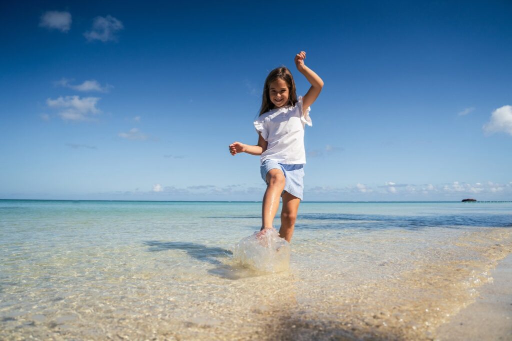 Trou aux Biches Beachcomber Playing in the Ocean